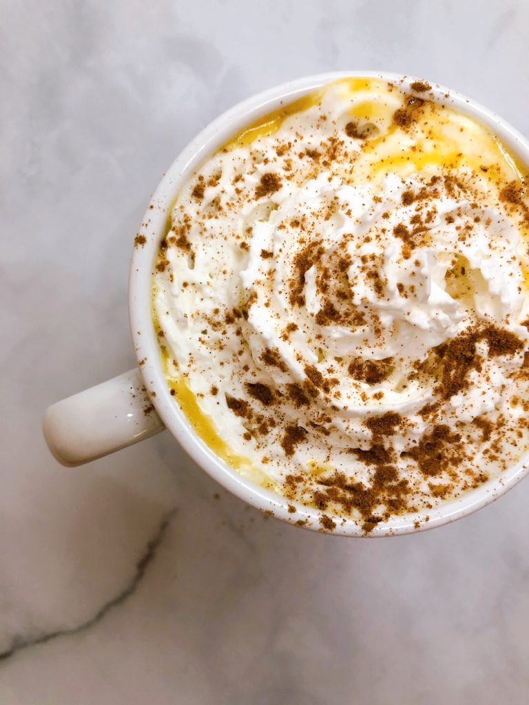 A vegan version of the delicious fall beverage, the pumpkin white hot chocolate. Perfect to cozy up on the couch with a book & blanket. | Vitality Vixens | Healthy Lifestyle Blog