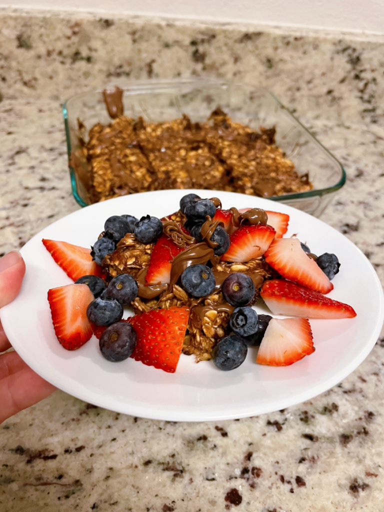 This baked oatmeal bars recipe is the perfect combo of healthy ingredients, melty chocolate & heaven in a bite. Finished in under 30 minutes! | Healthy Breakfast Recipes | Vitality Vixens Healthy Lifestyle Blog