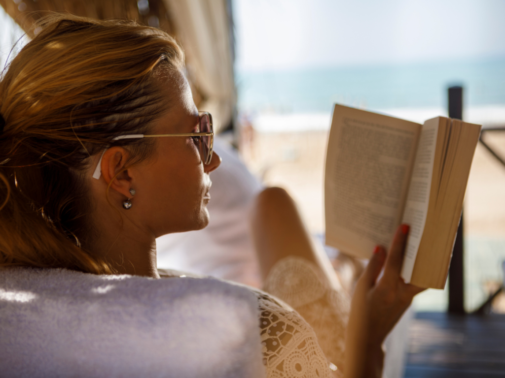 My summer selection of light and breezy beach reads for 2022. Read these laying by the pool, or on the beach, with a pina colada in hand. | Vitality Vixens Healthy Lifestyle Blog
